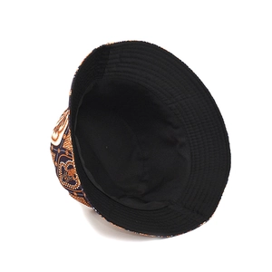 Reversible bucket hat with orange paisley print and black cotton lining for outdoor style