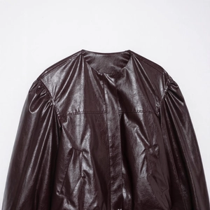 Deep brown faux leather bomber jacket with a round neck and textured shoulder detail