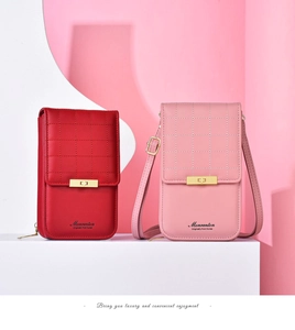 Detail of red and pink crossbody phone bags with quilted pattern and gold buckle