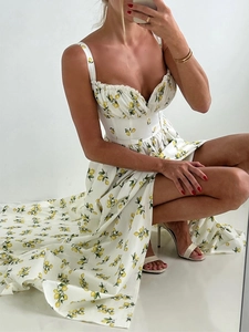 Detail of floral spaghetti strap maxi dress with lemon print and sexy high side slit