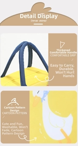 Detail of yellow lunch bag with thick blue handle and cartoon duck print on canvas