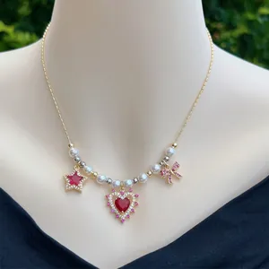 18K gold plated necklace with red heart, pink bow pendants and faux pearls