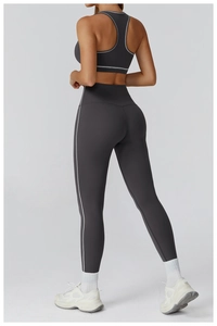 Macro detail of high-stretch sports fabric and white contrast lines on yoga legging set