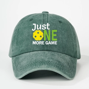 Detail of washed cotton baseball cap with JUST ONE MORE GAME print and pickleball graphic
