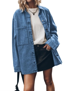 Detailed close-up of retro blue denim shirt featuring oversized pockets and relaxed fit