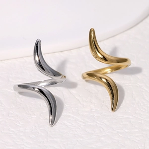 Minimalist wave titanium steel rings in gold and silver colors with polished finish