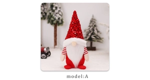 Close-up of red sequined Christmas gnome kitchen apron decor in a festive snow scene
