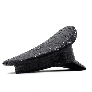 Side view of black sequined captain hat with shiny texture and stiff brim for parties