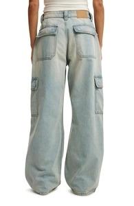 Detail view of baggy cargo jeans with large side pockets and relaxed straight leg cut