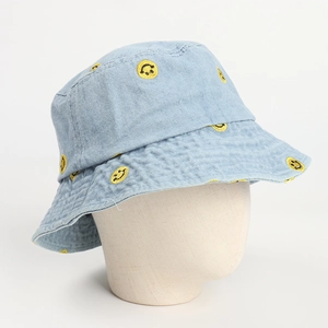 Light blue denim bucket hat with yellow smiley face embroidery and wide sun shade brim