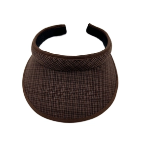 Detail view of woven brown sun visor with sweatband and textured pattern for kids