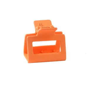 Detail of a square 5cm orange matte shark hair claw clip with a strong metal spring