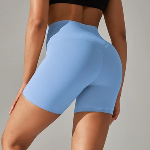 Close-up of high-waisted yoga shorts featuring push-up seam details and stretch fabric