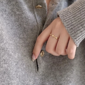 Minimalist 925 silver heart ring in gold finish worn on finger for a stylish look