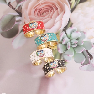 Colorful Evil Eye heart rings in red, blue, white, and black with gold finish
