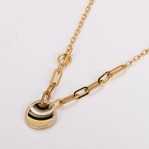 Gold stainless steel paperclip necklace with black and white pavé diamond round pendant