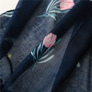 Lightweight navy scarf with pink tulip floral print in a soft cotton linen texture