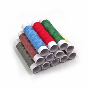 Polyester sewing thread set with 12 assorted colors stacked in a pyramid on white background