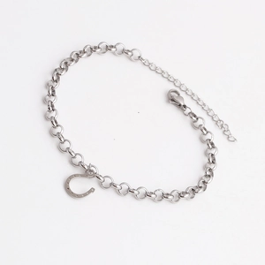 Sleek silver titanium steel horseshoe pendant bracelet with lobster clasp on white background