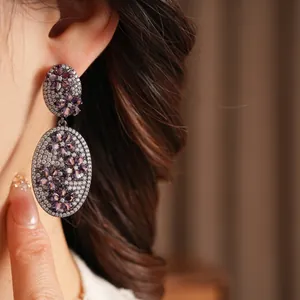 Vintage-style oval drop earrings with purple zircon flowers and black-plated metal