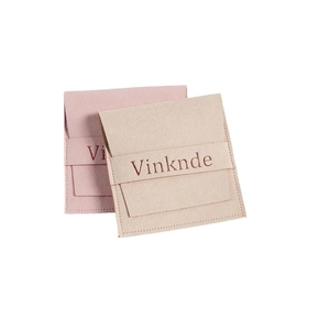 Pink and beige faux suede microfiber jewelry pouches with drawstring and Vinknde logo