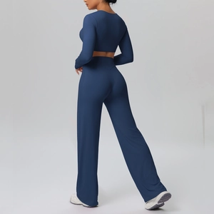 Rear view of deep navy long-sleeved crop top and high-waist wide-leg sports pants set
