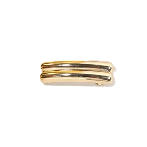 Minimalist double-bar golden metal hair clip with a polished finish and elegant shine