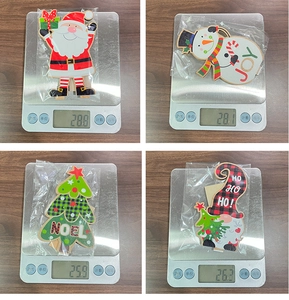 Weight measurement of wooden Christmas ornaments including Santa, Snowman and Tree icons
