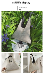 Detail view of cream white woven tote bag with contrasting black handles and mesh texture
