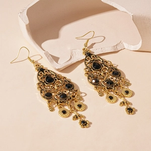 Vintage golden hollow-out drop earrings with black gemstones and elegant floral tassels