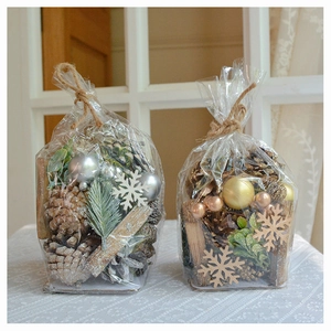Macro detail of two decorative Christmas potpourri bags with pine cones and snowflakes