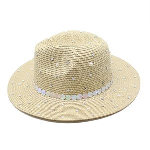 Detail of woven straw fedora hat featuring white pearls, rhinestones and sequins trim