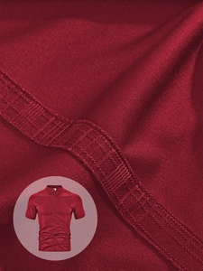 Detailed texture of burgundy men's polo shirt with waffle knit fabric and stitching