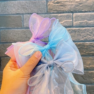 Three-layered chiffon bow hair clips in purple, blue, and grey for girls