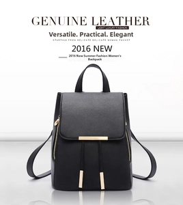 Detail of black pebbled leather backpack showing golden zippers and drawstring closure