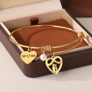 Close-up of golden adjustable MOM heart bracelet with infinite symbol in a jewelry box