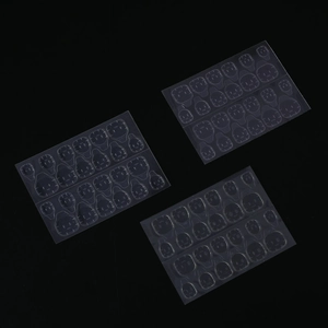 Close-up of three sheets of transparent double-sided adhesive jelly glue for nail application
