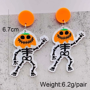 Detailed size view of Halloween pumpkin skull earrings made of orange acrylic