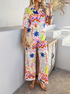 Detailed view of bohemian two-piece set featuring vibrant abstract solar and geometric prints