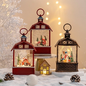 Christmas snow globe lantern with Santa Claus and snowman miniatures in barn style decor