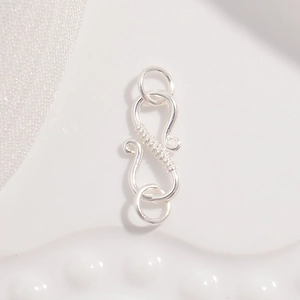 Detailed view of S925 sterling silver S-shaped clasp hooks for jewelry DIY crafting