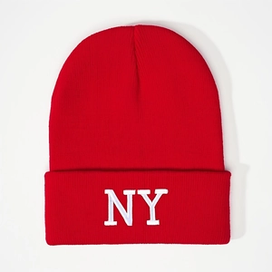 Classic red knit beanie with white NY embroidery and foldable cuff for winter warmth