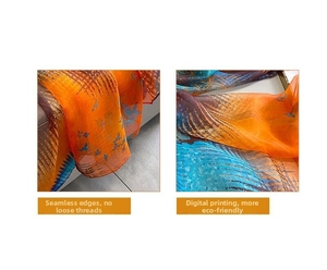 Detailed view of orange and blue printed silk scarf with fine edge stitching and texture