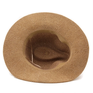 Detailed macro view of the inner woven texture and sweatband of the sun straw hat