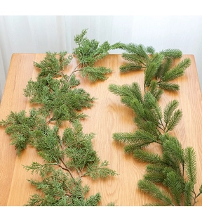 Detailed macro view of artificial pine and cypress needles for DIY Christmas decor