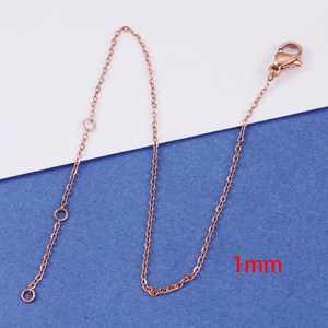 Close-up of 1mm rose gold stainless steel extender chain with lobster clasp detail