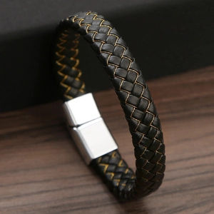 Handmade black braided leather bracelet with gold stitching and silver magnetic metal clasp