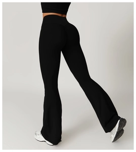 Detail view of high waist flared yoga pants with butt lifting cut and elastic fabric