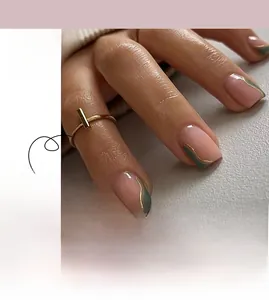 Detail of French style green wavy press-on nails with elegant gold line accents