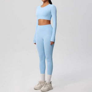 Side view of sky blue long sleeve yoga set featuring high waist leggings and crop top